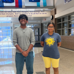 Two tech students standing in a hallway