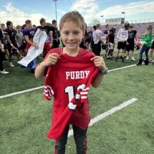 Major with a Brock Purdy jersey