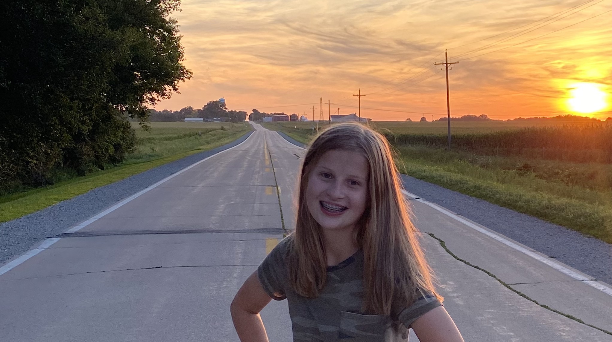 emma standing in a sunset